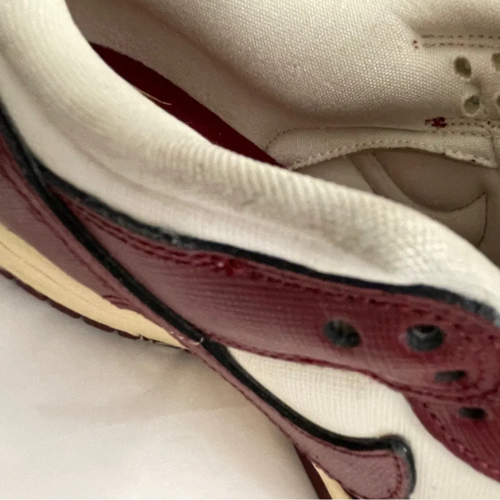 Nike Women’s White and Burgundy Sneakers with Gold Accents